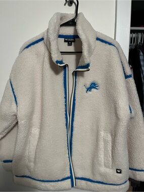 The Wild Collective White Sherpa Jacket with Blue Trim & Lions Patch